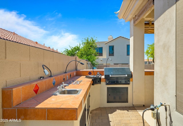 13614 N 12th Way, Phoenix, AZ 85022 - view of patio with a sink, fence, area for grilling, and exterior kitchen