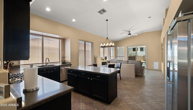 13614 N 12th Way, Phoenix, AZ 85022 - kitchen with lofted ceiling, a sink, dark cabinets, stainless steel appliances, and ceiling fan with notable chandelier