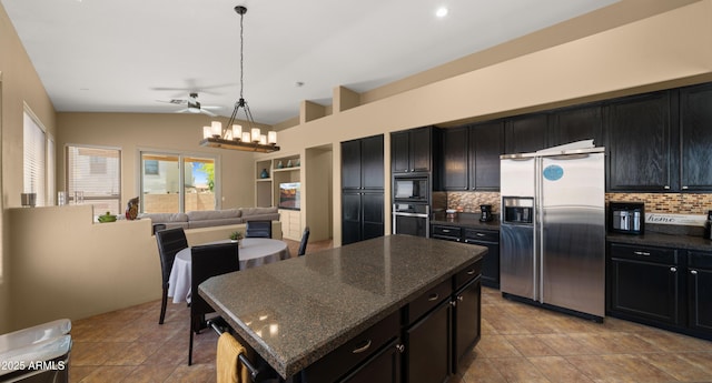13614 N 12th Way, Phoenix, AZ 85022 - kitchen with dark cabinetry, stainless steel fridge, and decorative backsplash