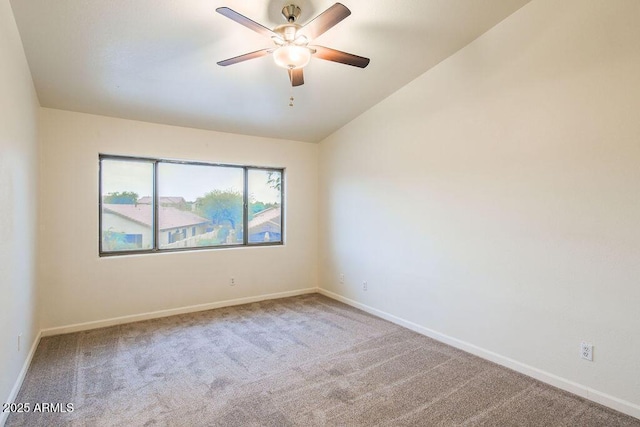 spare room with ceiling fan and carpet flooring