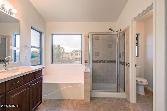 full bathroom with vanity, shower with separate bathtub, and toilet