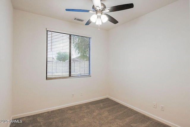 carpeted spare room with ceiling fan