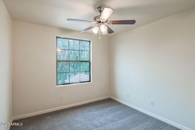 spare room featuring ceiling fan and carpet flooring