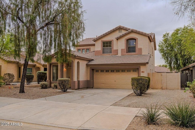 mediterranean / spanish-style home with a garage