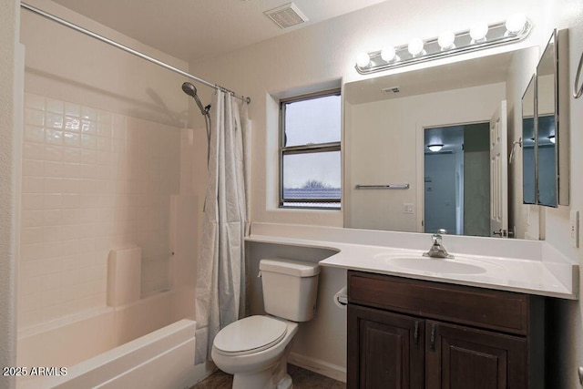 full bathroom with vanity, shower / bath combo with shower curtain, and toilet