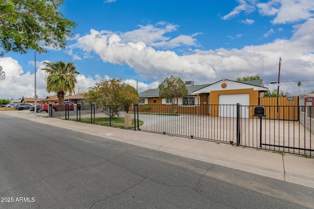 6837 W Camelback Rd, Phoenix, AZ 85033 - ranch-style home with a garage, a fenced front yard, and stucco siding
