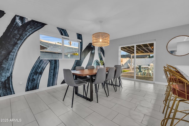 8243 E Montecito Ave, Scottsdale, AZ 85251 - dining room featuring plenty of natural light and baseboards