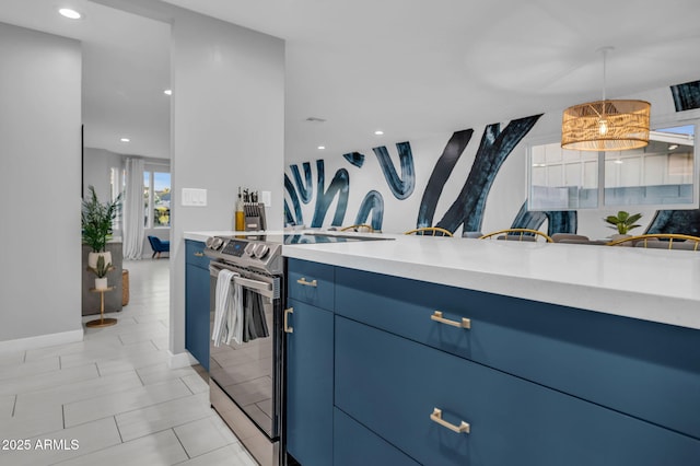 8243 E Montecito Ave, Scottsdale, AZ 85251 - kitchen featuring baseboards, decorative light fixtures, stainless steel range with electric stovetop, light countertops, and blue cabinets