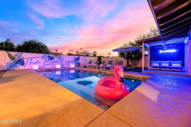 8243 E Montecito Ave, Scottsdale, AZ 85251 - pool at dusk with a patio area, a fenced backyard, and a fenced in pool