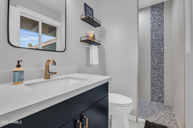 8243 E Montecito Ave, Scottsdale, AZ 85251 - full bathroom featuring a tile shower, toilet, and vanity