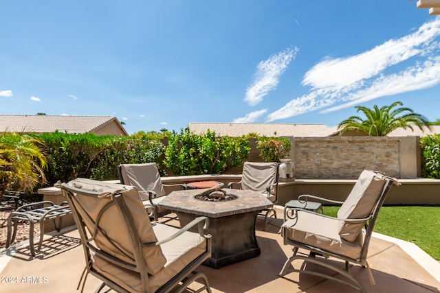 view of patio / terrace featuring an outdoor fire pit