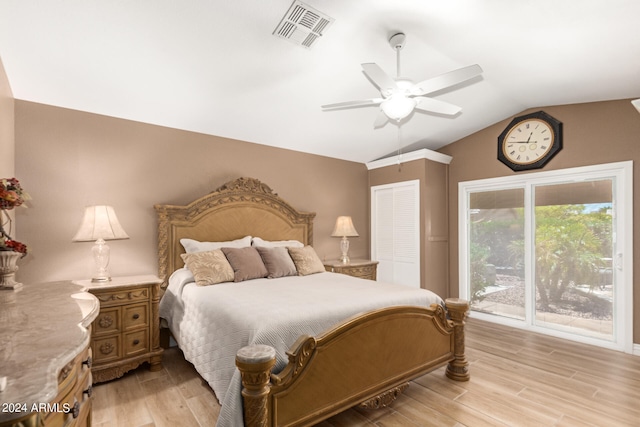 bedroom featuring ceiling fan, light hardwood / wood-style flooring, a closet, and lofted ceiling