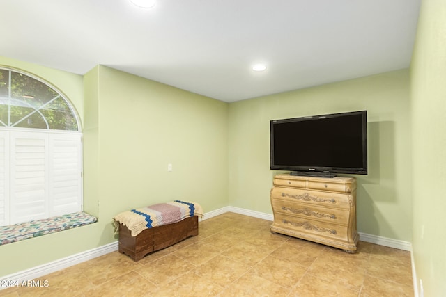 bedroom featuring light tile patterned floors