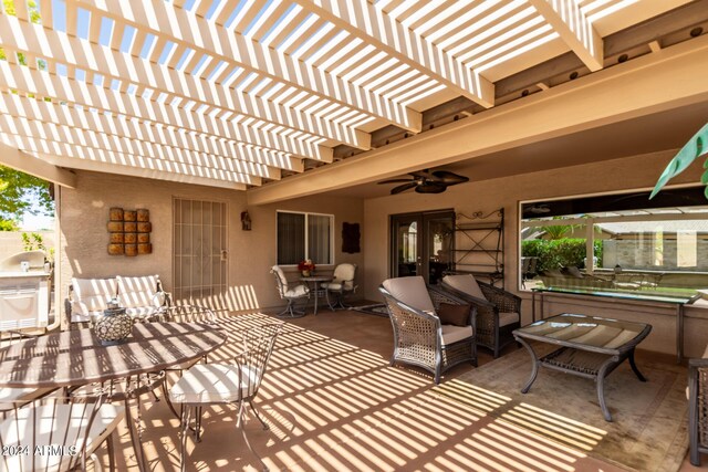 view of patio featuring ceiling fan, an outdoor living space, and a pergola