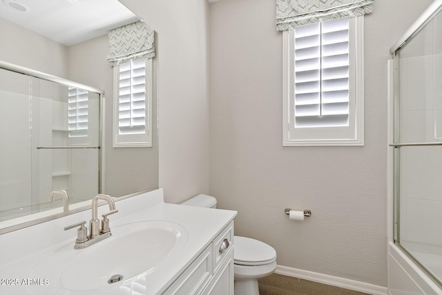 full bath featuring baseboards, toilet, and vanity