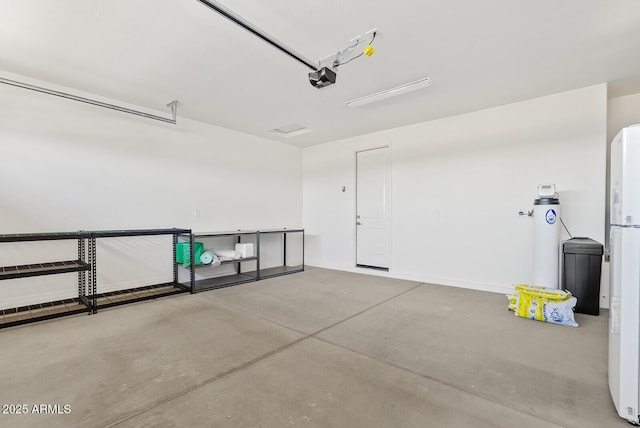 garage featuring water heater and a garage door opener