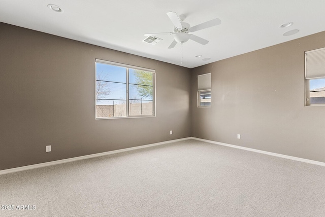 carpeted spare room featuring recessed lighting, visible vents, ceiling fan, and baseboards