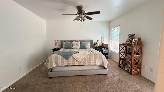 carpeted bedroom with a ceiling fan and baseboards