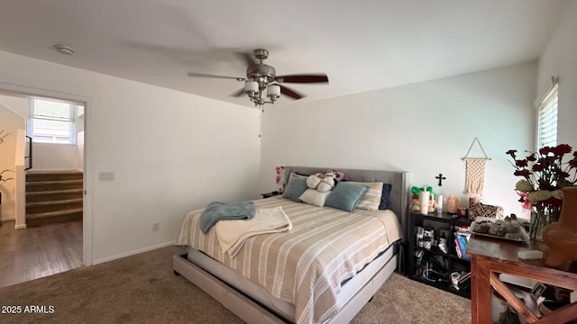 carpeted bedroom featuring a ceiling fan