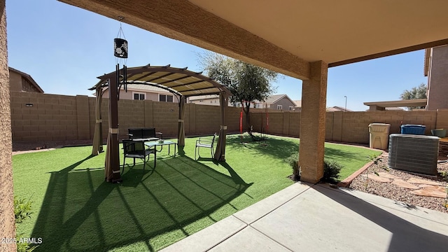 view of yard featuring cooling unit, a patio, and a fenced backyard