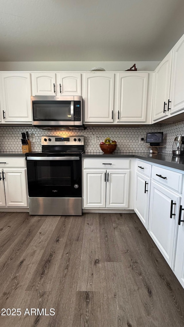 kitchen featuring white cabinetry, dark wood-style floors, and appliances with stainless steel finishes