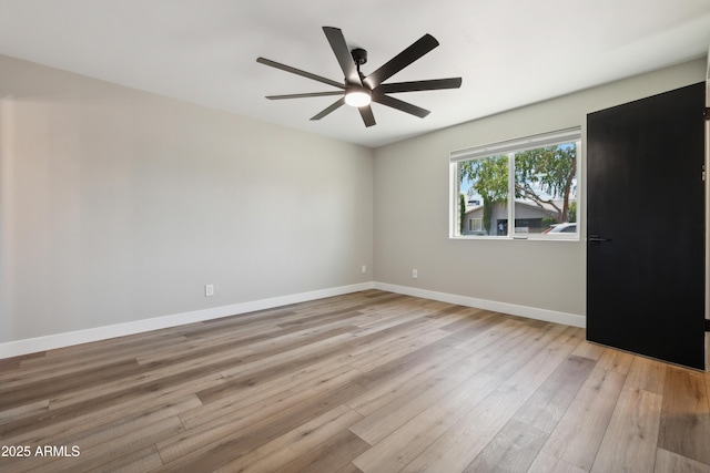 spare room featuring ceiling fan and light wood-type flooring