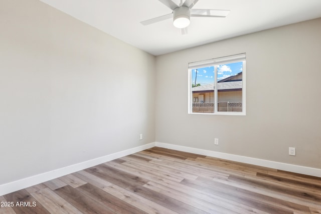 empty room featuring light hardwood / wood-style floors and ceiling fan