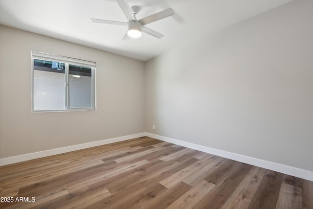 unfurnished room with ceiling fan and wood-type flooring