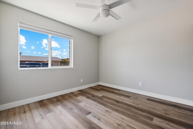 unfurnished room with light hardwood / wood-style flooring and ceiling fan