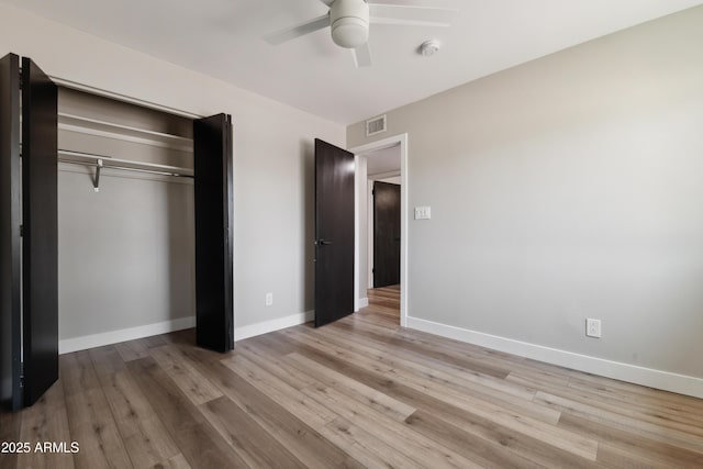 unfurnished bedroom with a closet, ceiling fan, and light hardwood / wood-style floors