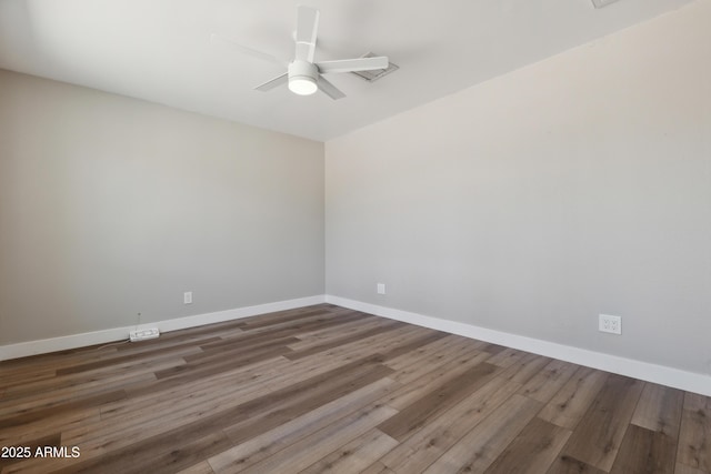 unfurnished room with ceiling fan and hardwood / wood-style flooring