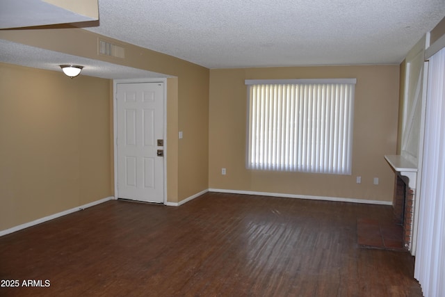 8124 N 33rd Dr, Phoenix, AZ 85051 - unfurnished living room with a textured ceiling, wood finished floors, baseboards, and visible vents
