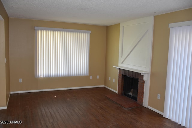 8124 N 33rd Dr, Phoenix, AZ 85051 - unfurnished living room with a textured ceiling, wood finished floors, and a brick fireplace