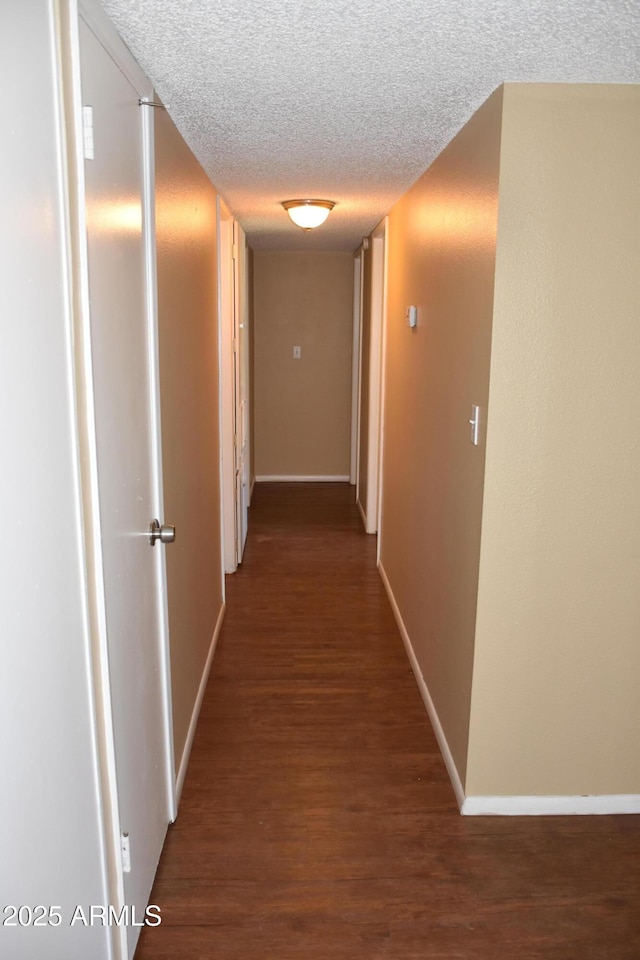 8124 N 33rd Dr, Phoenix, AZ 85051 - hall with a textured ceiling, baseboards, and wood finished floors