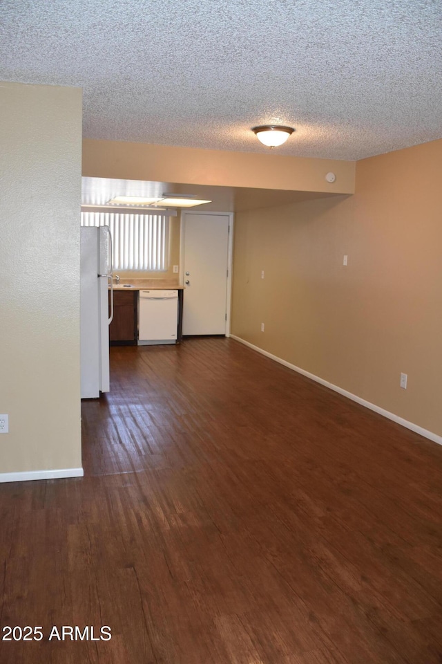 8124 N 33rd Dr, Phoenix, AZ 85051 - unfurnished room featuring baseboards, a textured ceiling, and dark wood finished floors