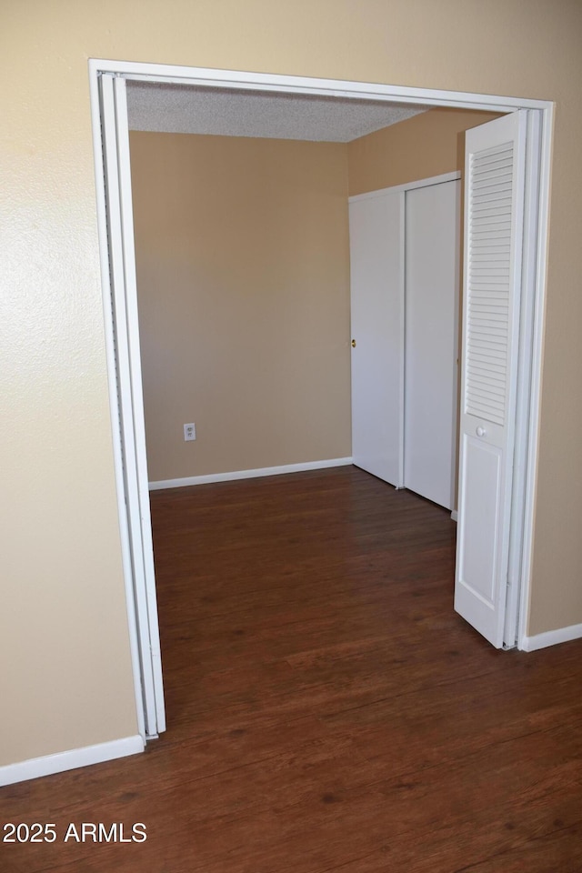 8124 N 33rd Dr, Phoenix, AZ 85051 - interior space with baseboards and dark wood finished floors