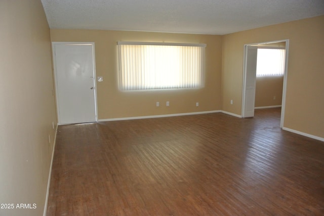 8124 N 33rd Dr, Phoenix, AZ 85051 - unfurnished room with a textured ceiling, wood finished floors, and baseboards