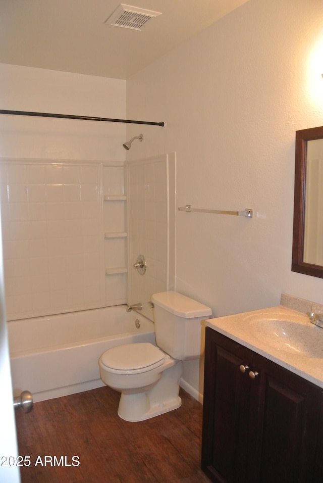 8124 N 33rd Dr, Phoenix, AZ 85051 - bathroom featuring shower / bathtub combination, vanity, visible vents, toilet, and wood finished floors