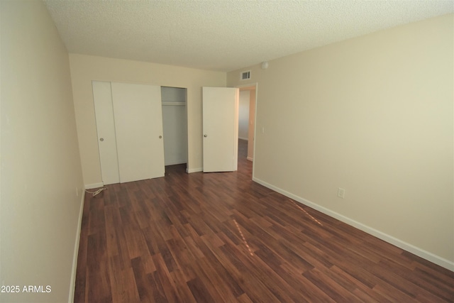 8124 N 33rd Dr, Phoenix, AZ 85051 - unfurnished bedroom with dark wood-type flooring, visible vents, baseboards, and a closet