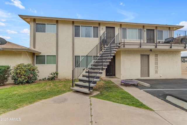 8124 N 33rd Dr, Phoenix, AZ 85051 - view of building exterior with uncovered parking and stairs