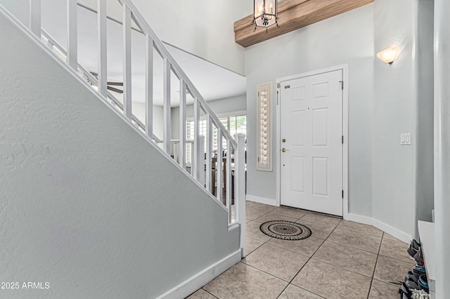 6422 W Range Mule Dr, Phoenix, AZ 85083 - tiled foyer with stairs and baseboards