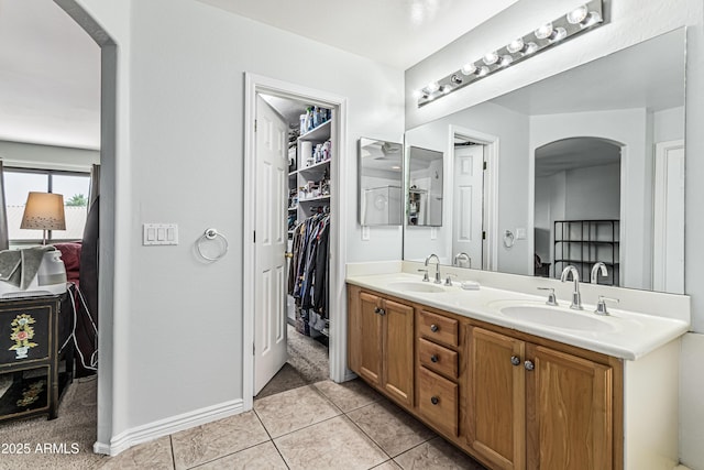6422 W Range Mule Dr, Phoenix, AZ 85083 - full bath with double vanity, baseboards, and tile patterned floors