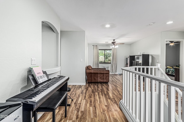 6422 W Range Mule Dr, Phoenix, AZ 85083 - sitting room with a ceiling fan, wood finished floors, recessed lighting, an upstairs landing, and baseboards