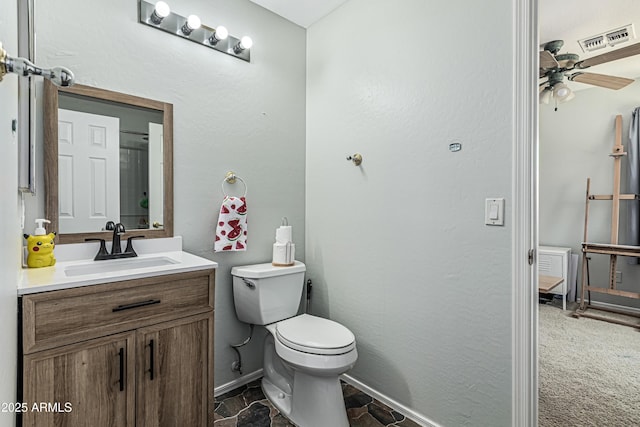 6422 W Range Mule Dr, Phoenix, AZ 85083 - bathroom featuring toilet, a ceiling fan, vanity, and baseboards