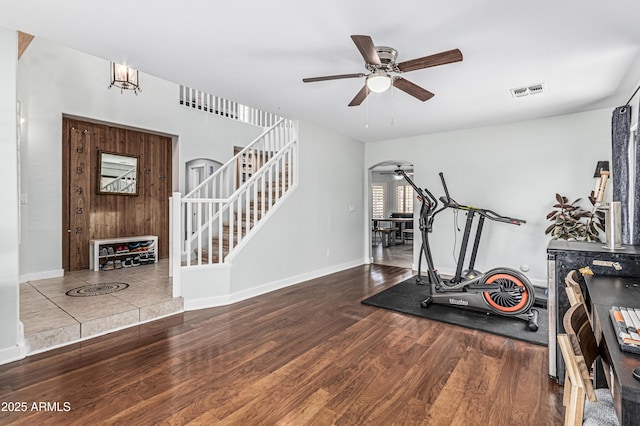 6422 W Range Mule Dr, Phoenix, AZ 85083 - workout area with a ceiling fan, wood finished floors, arched walkways, and baseboards