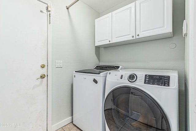 6422 W Range Mule Dr, Phoenix, AZ 85083 - laundry area with cabinet space, washer and clothes dryer, and light tile patterned floors