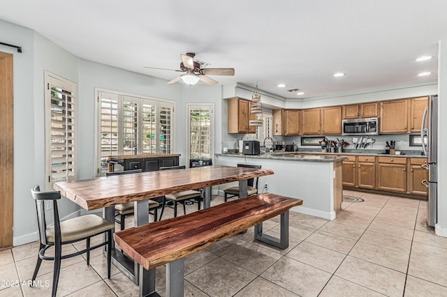 6422 W Range Mule Dr, Phoenix, AZ 85083 - dining space featuring light tile patterned floors, a ceiling fan, recessed lighting, and baseboards