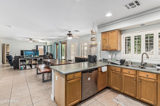 6422 W Range Mule Dr, Phoenix, AZ 85083 - kitchen with dishwasher, a sink, light tile patterned floors, a ceiling fan, and a peninsula