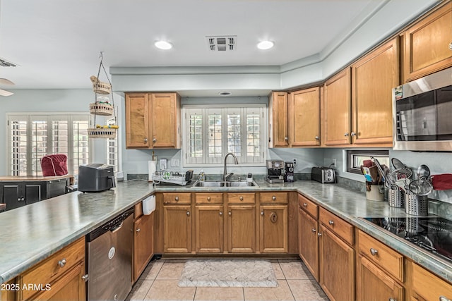 6422 W Range Mule Dr, Phoenix, AZ 85083 - kitchen with a sink, appliances with stainless steel finishes, and brown cabinetry