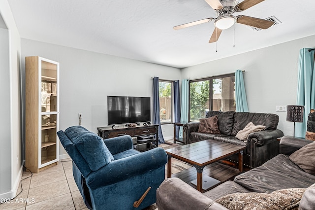 6422 W Range Mule Dr, Phoenix, AZ 85083 - living area with a ceiling fan, light tile patterned floors, and baseboards
